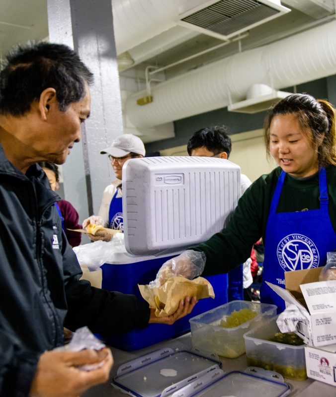 Vincentian Youth Distributing Meals